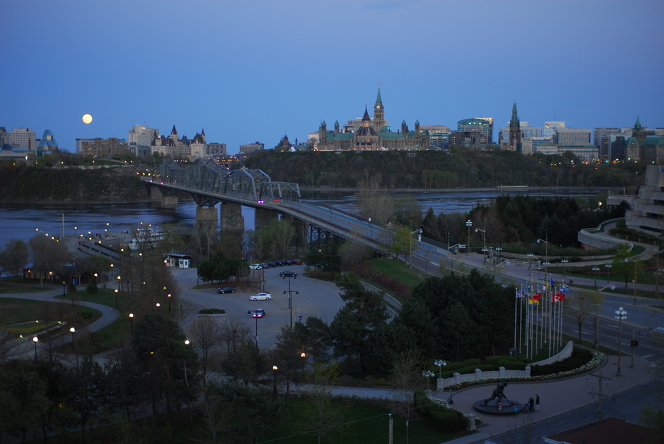 "Super Moon" rising over Parliament Buildings, Ottawa